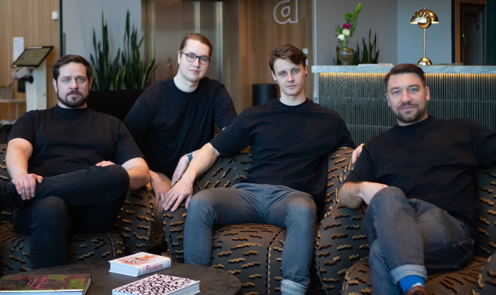 The four members of the STRGY AI founding team seated together in an office lounge.